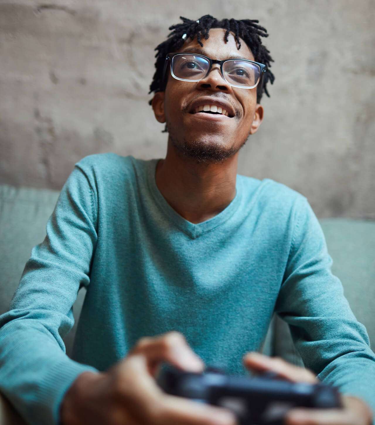 Man on couch with gaming controller